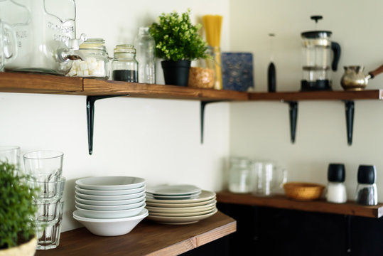 Dish On Open Shelves In Kitchen