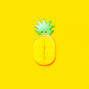 Flat lay bright sweet tropical pineapple of paper on yellow background top view copy space. Minimalistic creative summer food concept, origami paper fruit. Pineapple background