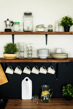 Dish On Open Shelves In Kitchen