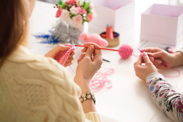 Young attractive girls in a crochet lesson