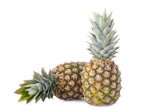 Two Whole Pineapples Isolated On White Background