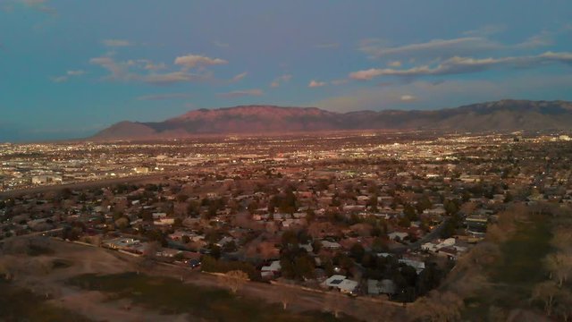 Aerial shot of the city of Albuquerque, NM during the sunset hour.