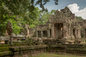 Fototapeta na wymiar Facade of temple ruins framed by trees