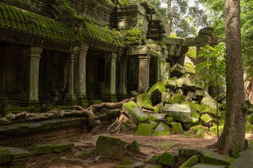 Fallen rocks by colonnade with mossy roof