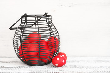 Red Easter eggs in wire basket