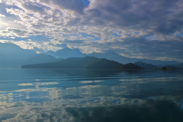 Beautiful landscape view of mountain and lake with reflection in the morning under sky and cloud, Nantou, Taiwan