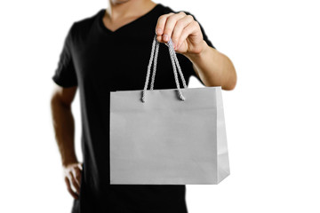 Man holding a gift bag. Close up. Isolated on white background