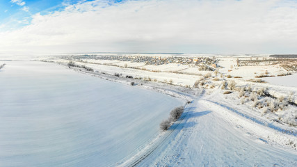 Aerial view of Ukrainian village in winter, view from afar