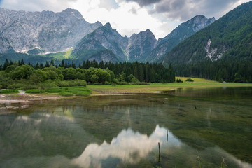 Fototapeta na wymiar Upper Lake of Fusine. Emerald waters. Tarvisio to be discovered. Friuli