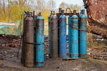 Several old liquefied gas cylinders.