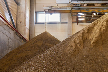 Granules of rape cakes in the agricultural factory for the production of rapeseed oil.
