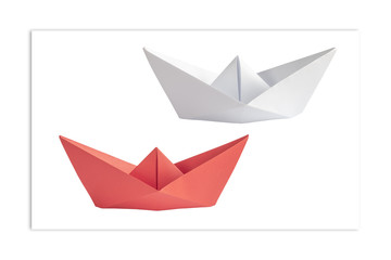 Origami. White and red ships opposite each other. The concept of minimalism.
