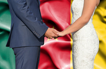 Husband and Wife holding hands - Conceptual photograph of marriage in Cameroon