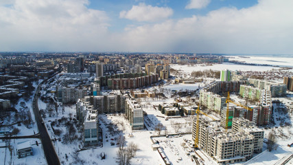 winter city pano with lot of houses and snow showed from drone , aerial photo 