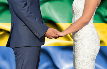 Husband and Wife holding hands - Conceptual photograph of marriage in Gabon
