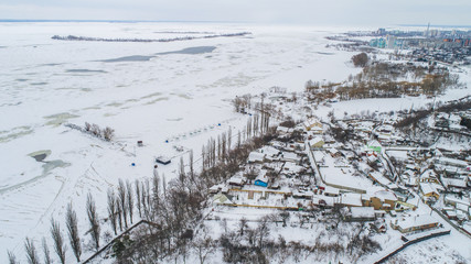 winter city pano with lot of houses and snow showed from drone , aerial photo 