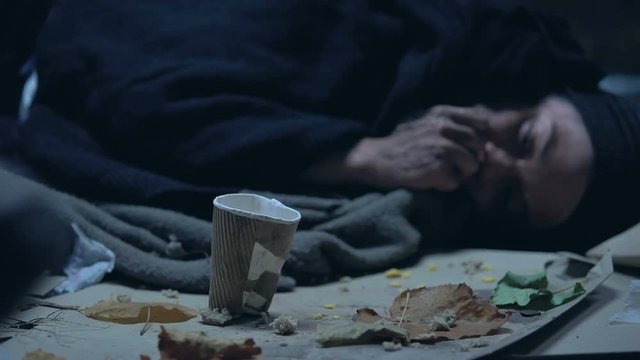 Passerby donating money hungry homeless vagabond, poverty and famine concept