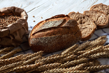 Still life with bread, flour and spikelets