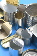 tin cans isolated on blue background