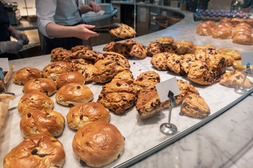 Variety of breads are sold on the marble table
