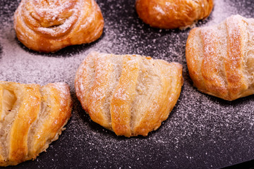 Pastries with apple in icing sugar