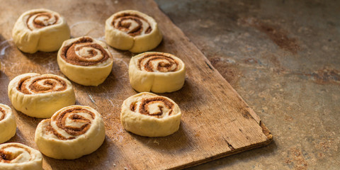buns  with cinnamon - Cinnabon cooking process. (food background). copy space