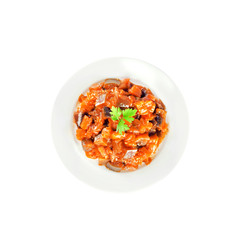 Aubergine stew with onions and tomato on a plate isolated on white background with clipping path