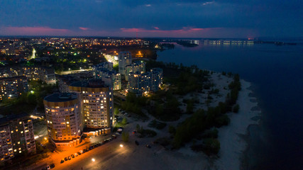 Fototapeta na wymiar night city with river aural pano photo shot from drone 
