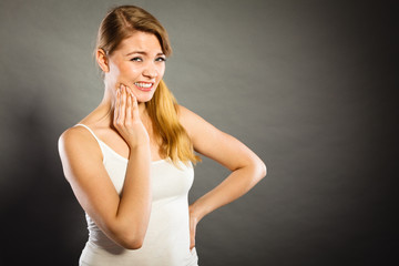 Woman suffering from tooth pain