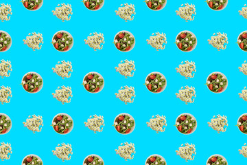 Cup with vegetable salad and chrysanthemum flowers on blue background Top view flat lay pattern