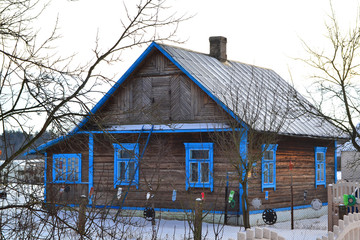 Ancient wooden traditional russian house. Vintage village of Belarus.