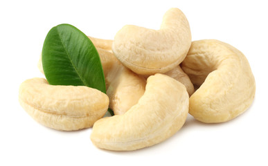 cashew with green leaves isolated on white background
