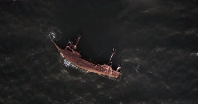 shipwreck aerial footage with a 90 degree angle. Cemetery of ships. Luanda. Angola.