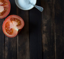red ripe tomatoes cut on the table
