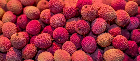 Zelfklevend Fotobehang  Fresh  Lychees Background. Lychee fruit texture © nataliazakharova