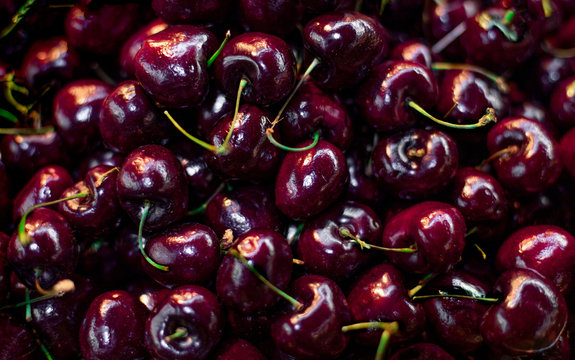 Ripe cherries background. Close up of cherry  berries with stalks