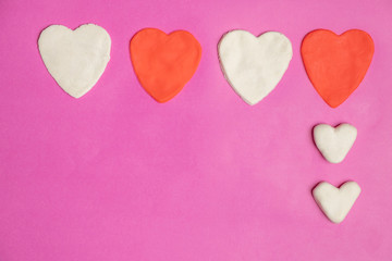 Fototapeta premium Big hearts on pink background with space for text, Love icon, valentine's day, relationships concept