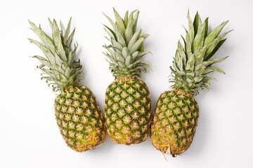 Obraz premium organic, juicy and sweet pineapples on white background