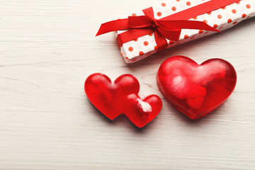 Valentine day background, handmade hearts on wood with copy space