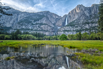 Naklejka na ściany i meble Yosemite Falls and its Reflection on the Water in the Valley
