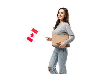 smiling female student holding canadian flag and notebooks isolated on white