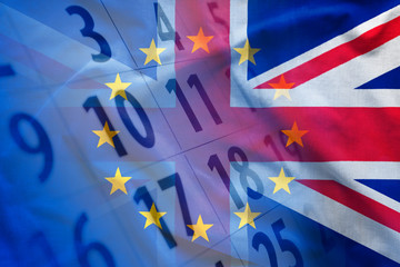European and British flags over calendar