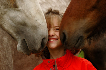 Little girl with foals