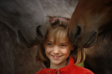 Little girl with foals