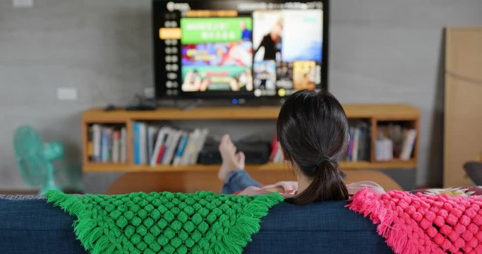 Woman enjoy the tv show at home