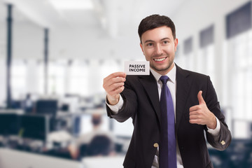 Business, technology, internet and networking concept. Young entrepreneur showing keyword: Passive...
