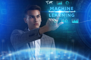 The concept of business, technology, the Internet and the network. A young entrepreneur working on a virtual screen of the future and sees the inscription: Machine learning