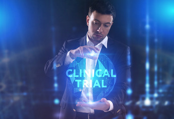 The concept of business, technology, the Internet and the network. A young entrepreneur working on a virtual screen of the future and sees the inscription: Clinical trial