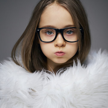 Portrait of stylish fashionista little girl face