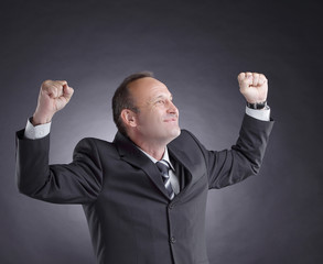 happy businessman isolated on black background. photo with copy space